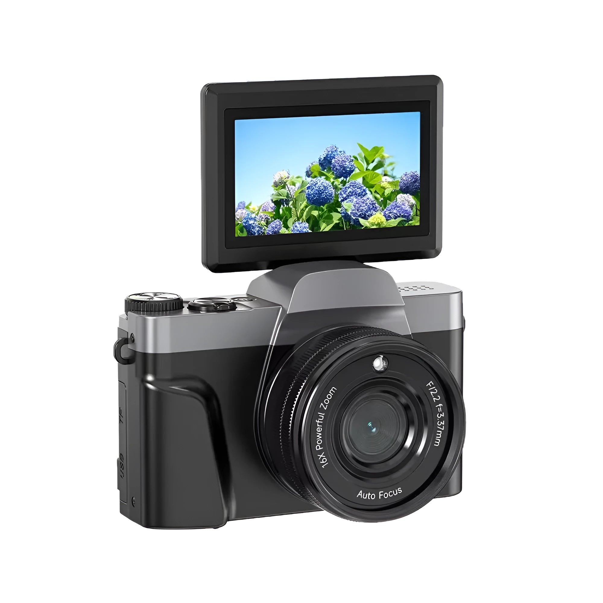 Black flip mirrorless digital camera resting on a cloth surface, showing its compact body and flip screen