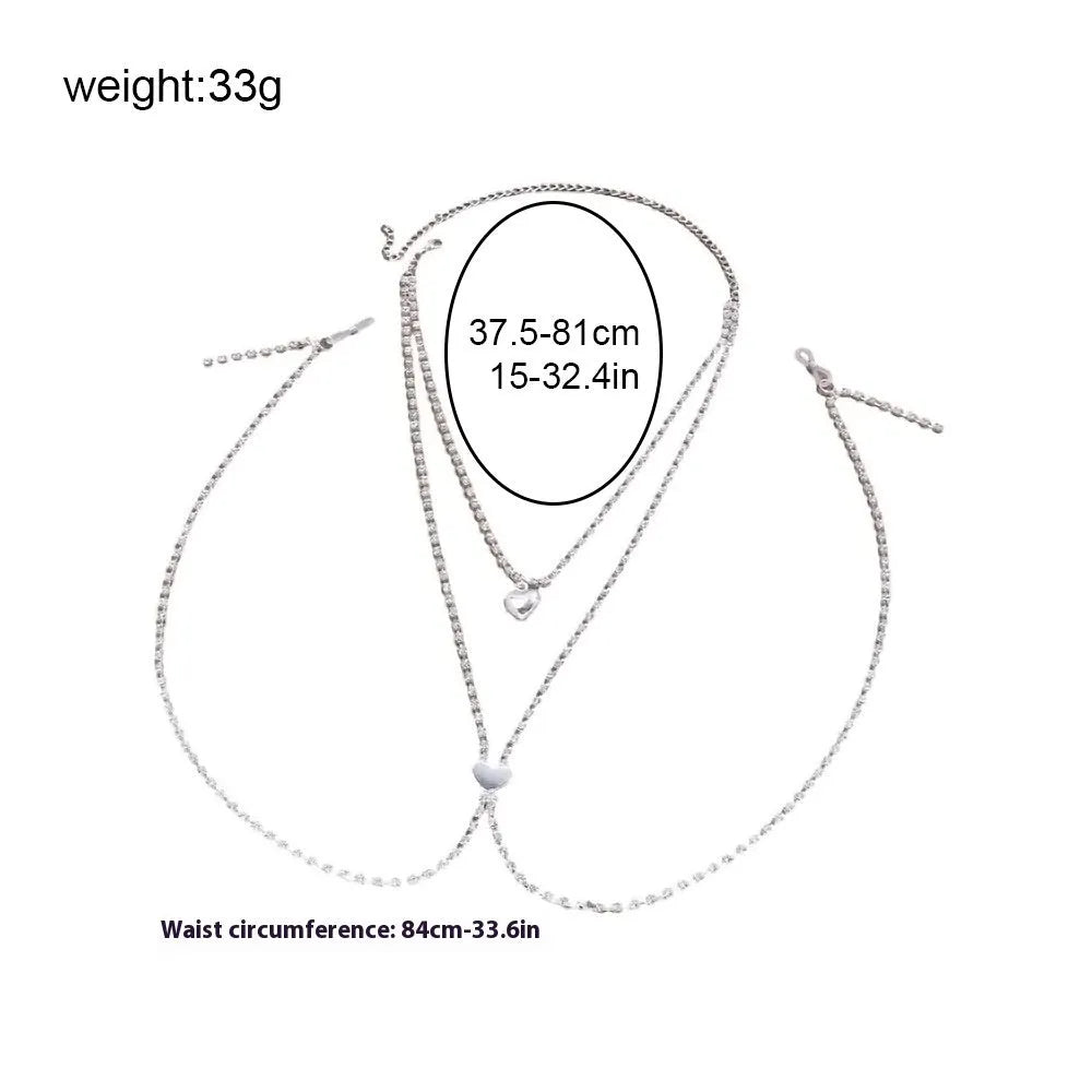 Gold or silver coloured heart-shaped body chain for women with rhinestone detailing.
