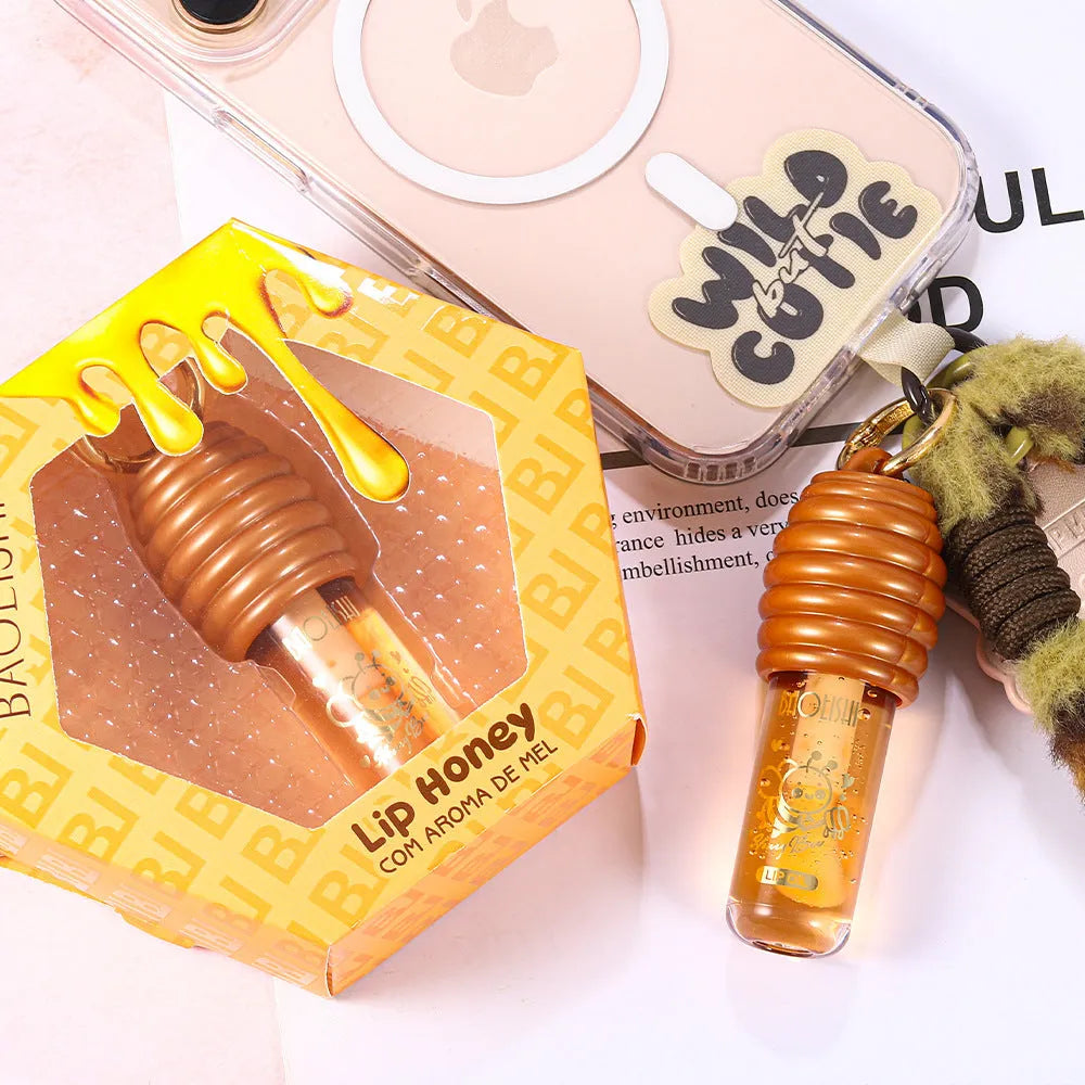 Honey Lip Gloss attached to a keychain for portable lip moisturising