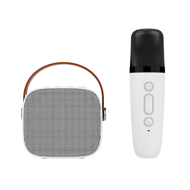 Small white portable Bluetooth speaker with microphone, shown next to its USB charging cable.