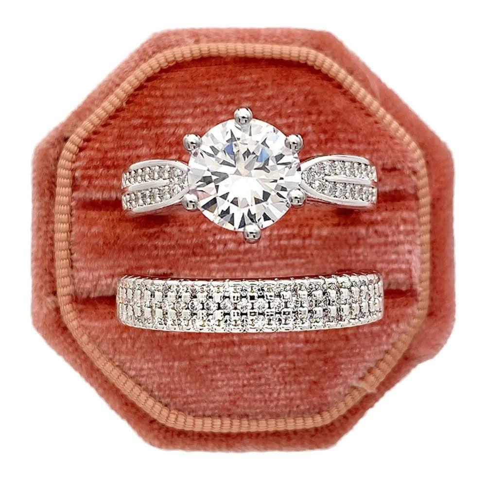Geometric style wedding ring paired with a matching simple bracelet band in a white gold colour finish.