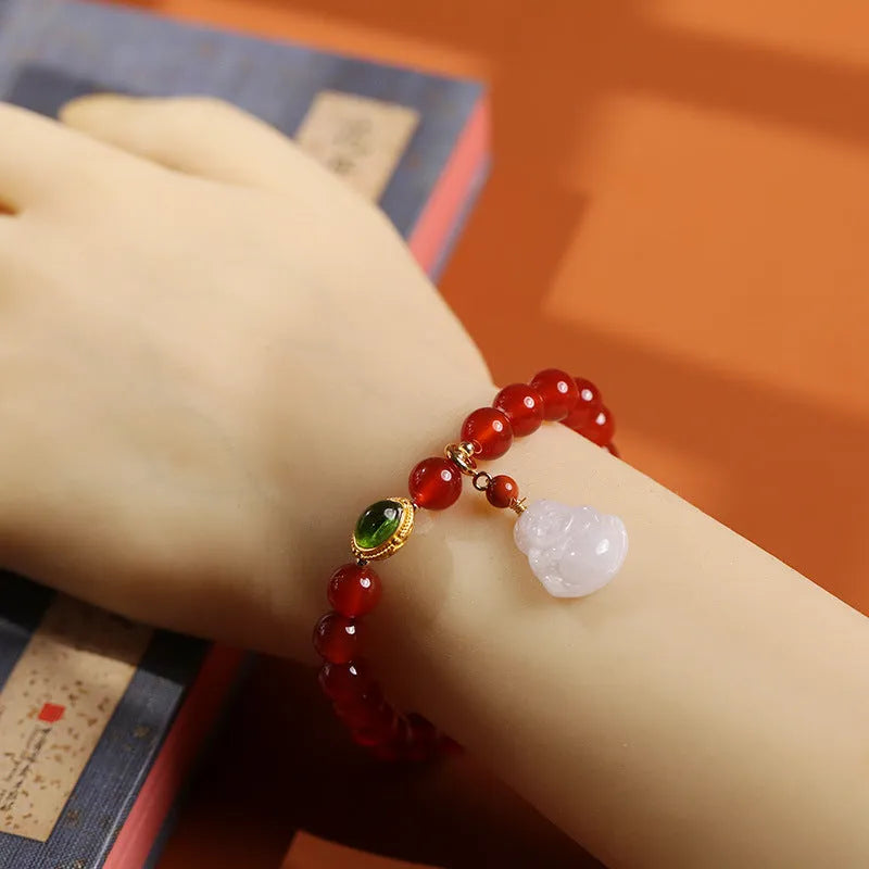 Red agate bracelet with ancient gold jade hanging element and Buddha pendant