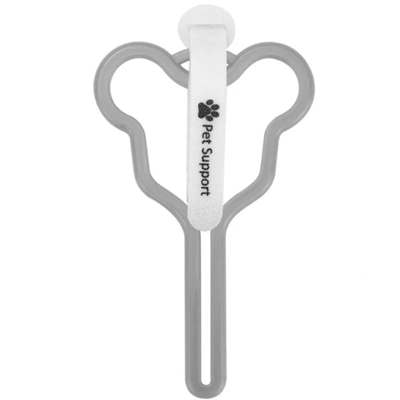 A hands-free dog poop bag holder with a hook and loop fastener strap, shown attached to a dog leash.