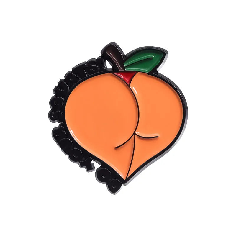 Colourful cartoon-style fruit metal brooch with a pin back on a denim jacket lapel.