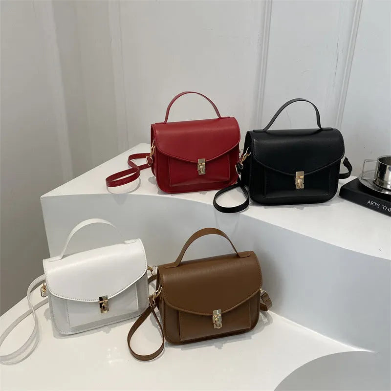 Horizontal square PU leather messenger bag in urban style with crossbody strap and sewing line detail.