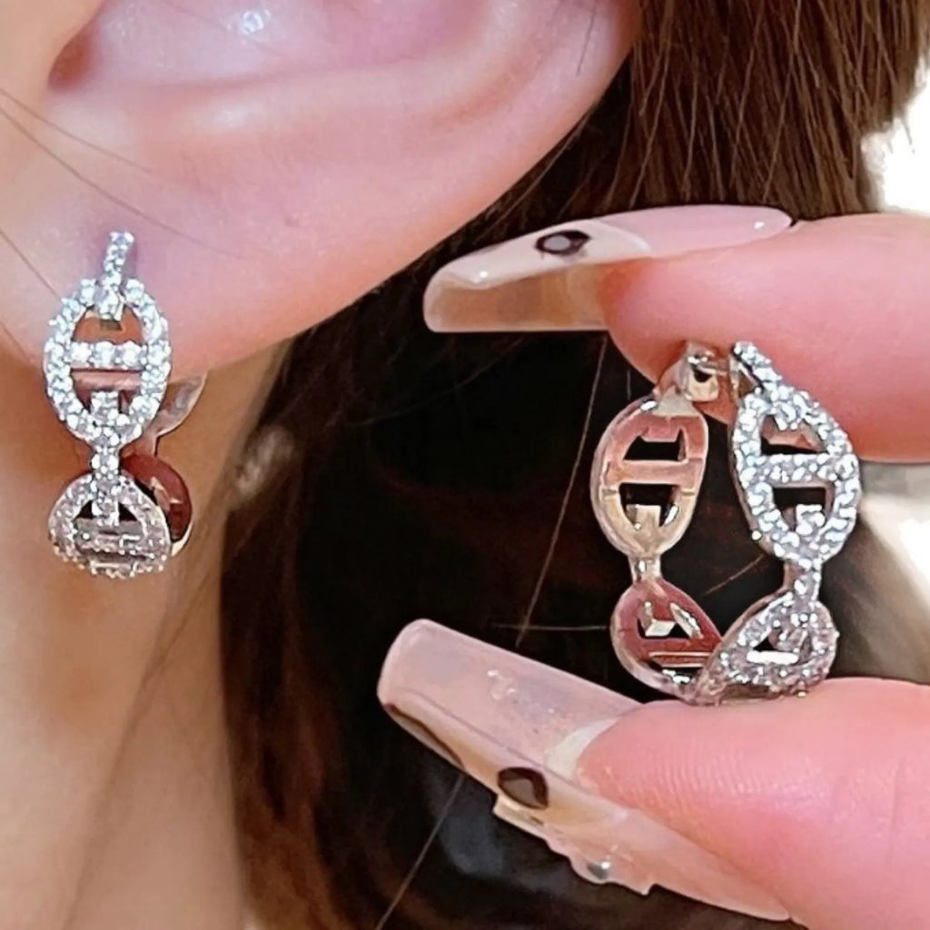 Women's diamond-design electroplated copper earrings in silver, gold, or rose gold finish.