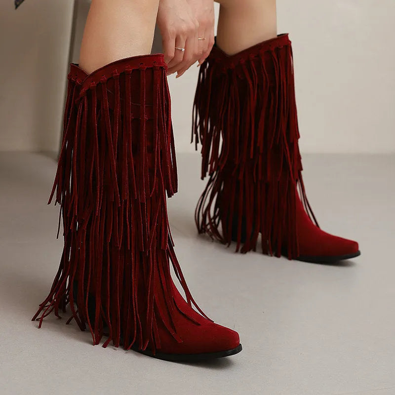 Women's suede knee-high boots with tassel detail and a chunky waterproof platform sole