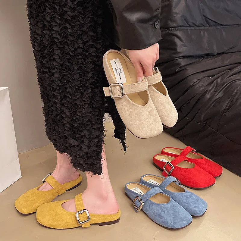 Women's flat apricot coloured slippers with a square toe, PU leather upper, and a dark rubber sole.