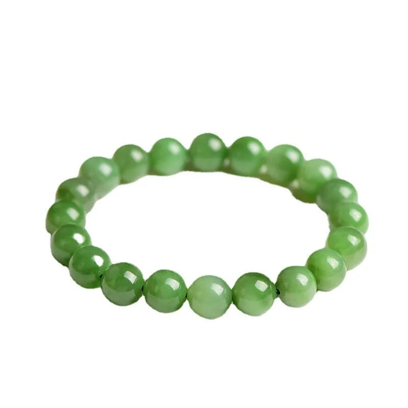 Natural Hetian jade jasper ball bracelet showing polished beads on a wrist.