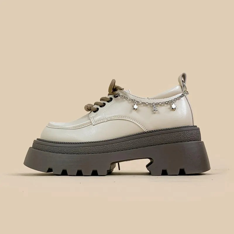 White women's platform Mary Jane shoes with chunky heel and XINGX bear design on round toe