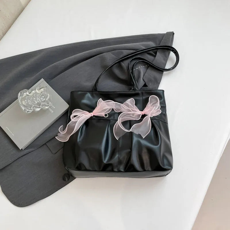 College style bow tote bag in black colour with double shoulder straps and large main compartment