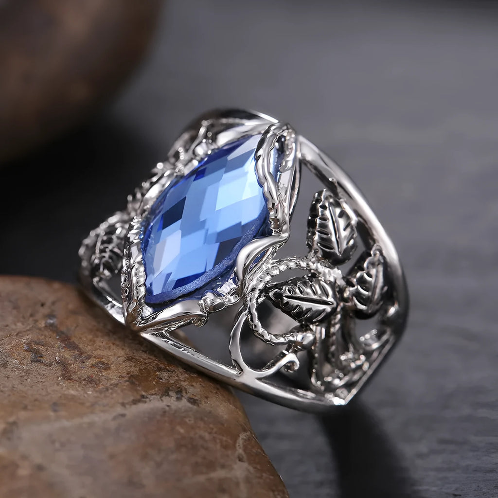 Women's blue crystal horse eye-shaped geometric alloy ring on a white background.