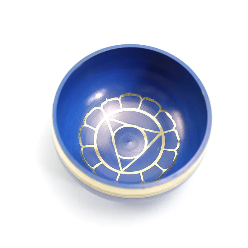 Seven colourful handmade Himalayan-style bowl percussion instruments arranged by size and colour