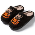 Black and white Halloween pumpkin slippers with plush upper and TPR rubber soles