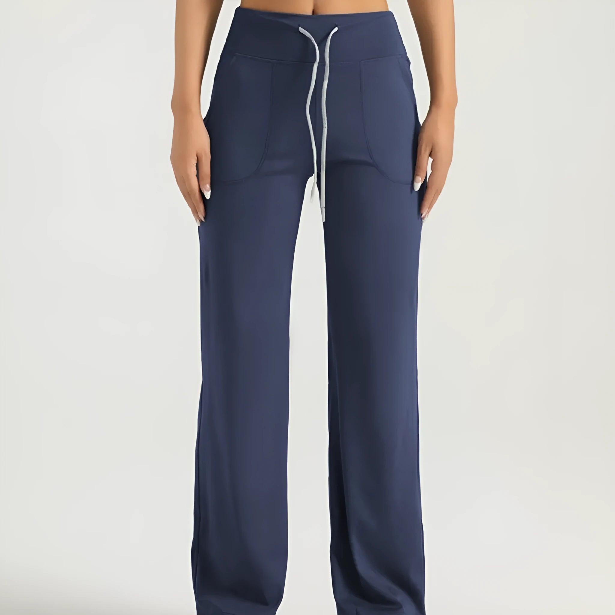 Women's high waist loose fit drawstring sports trousers in Star Black, side view, with elastic waistband and straight leg.