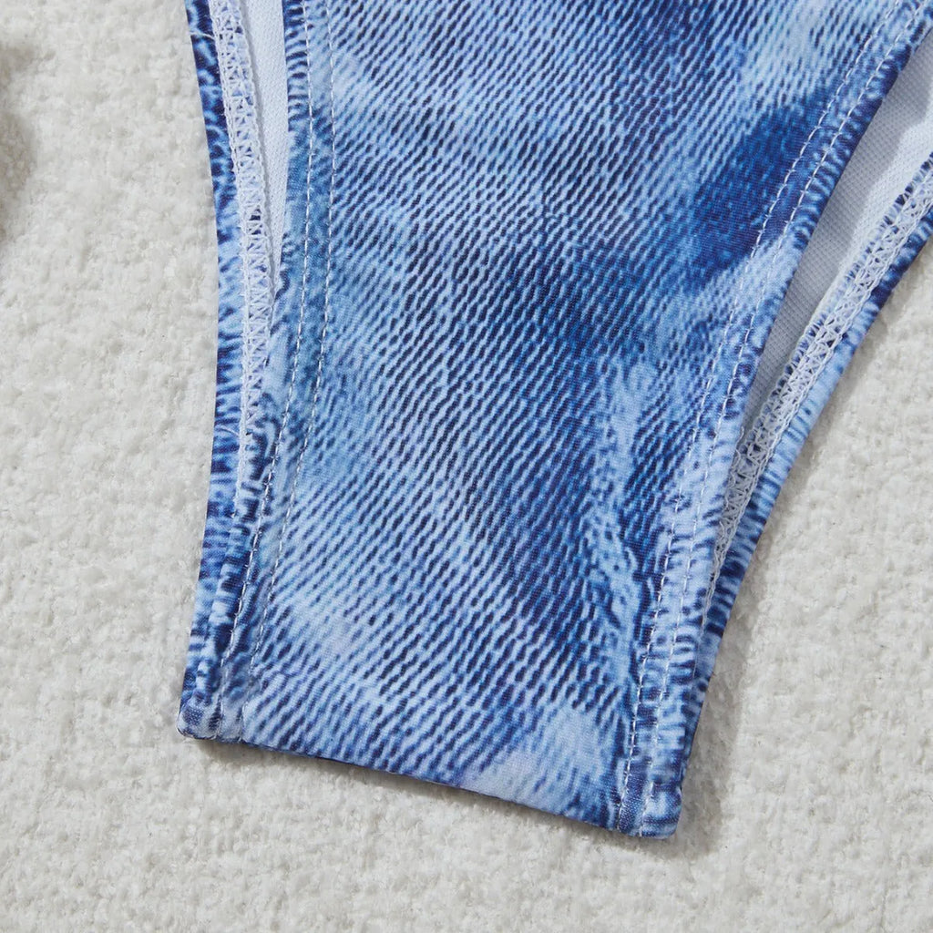 Denim blue printed women's bikini set with strap design on a mannequin.