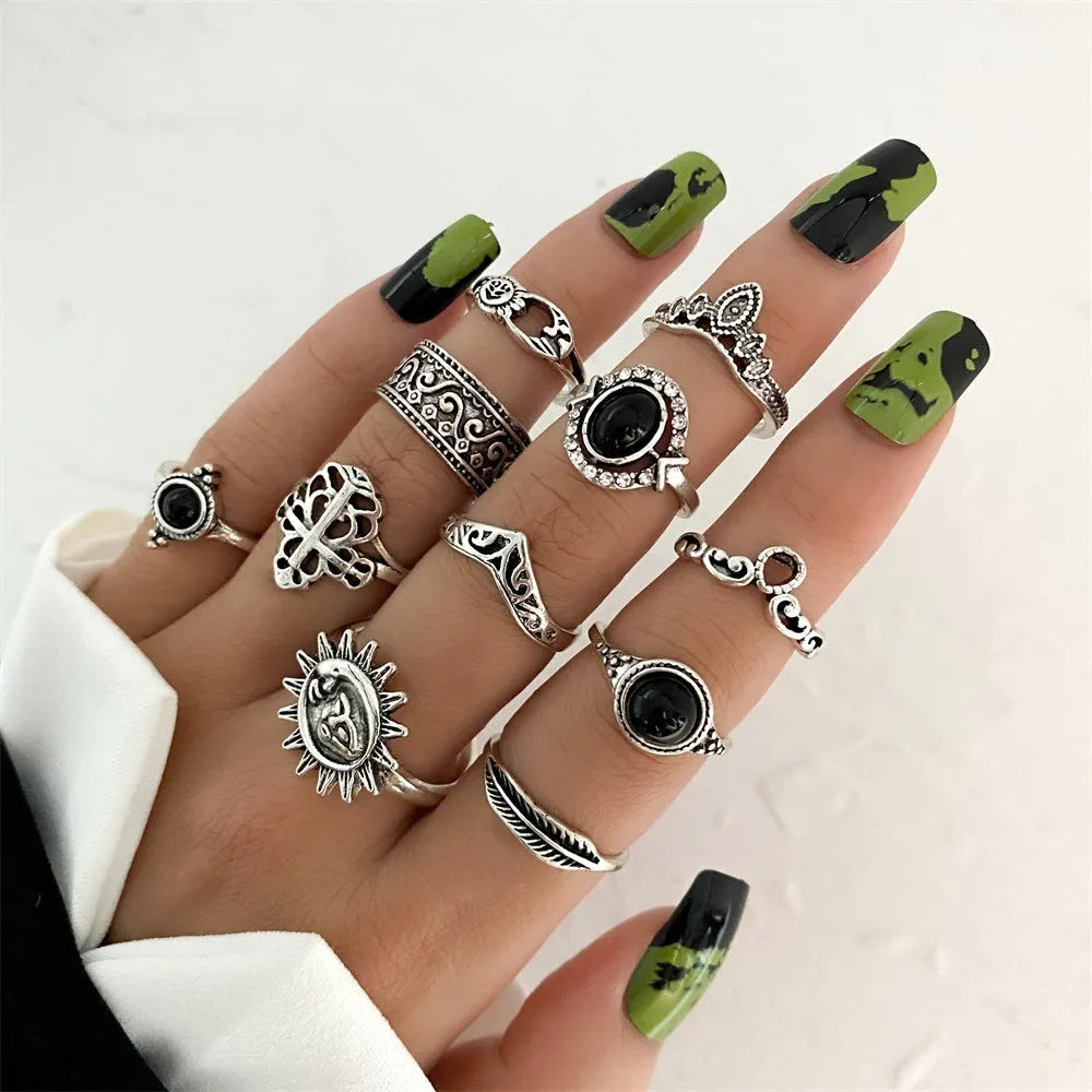 Alloy ring set with butterfly and snake retro geometric designs on display