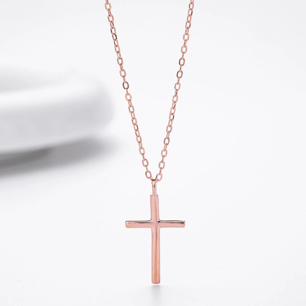 S925 sterling silver necklace with a simple glossy cross pendant on an O-shaped chain in a choice of gold, platinum, or rose gold plating.