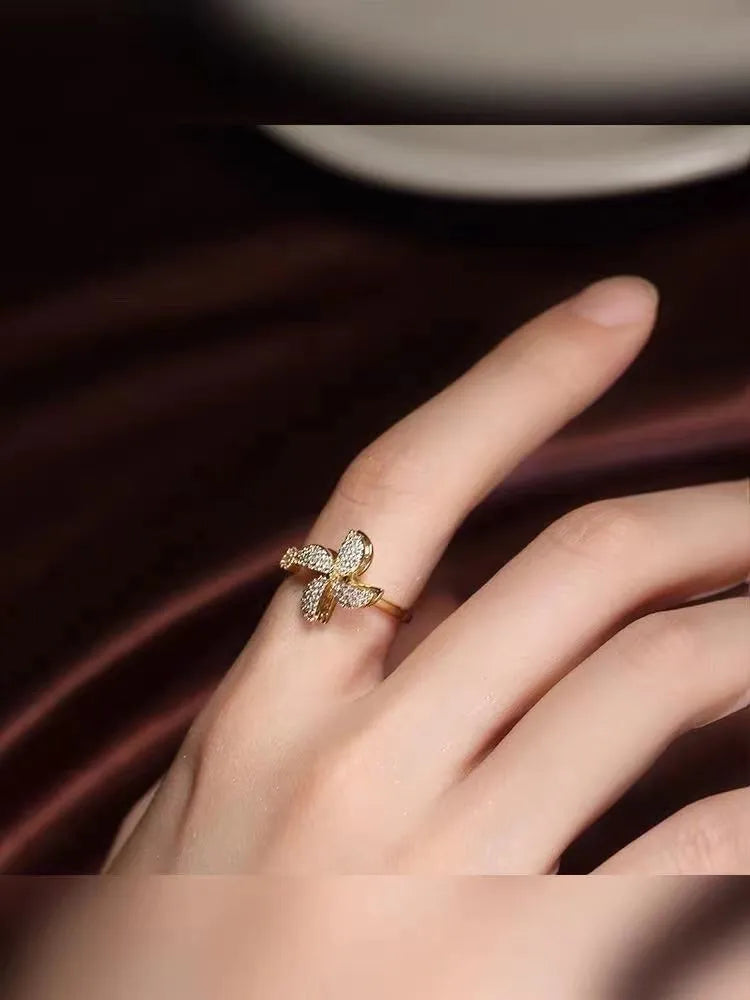 Geometric rotating ring with micro inlaid design in gold or silver colour