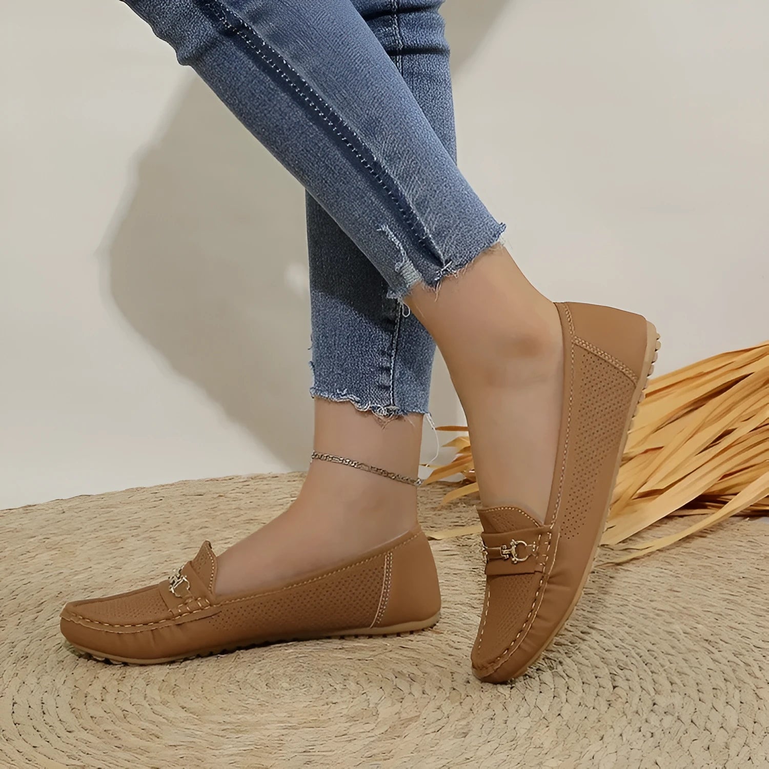 Women's flat casual shoe in artificial PU, shown in a neutral colour with a simple design.