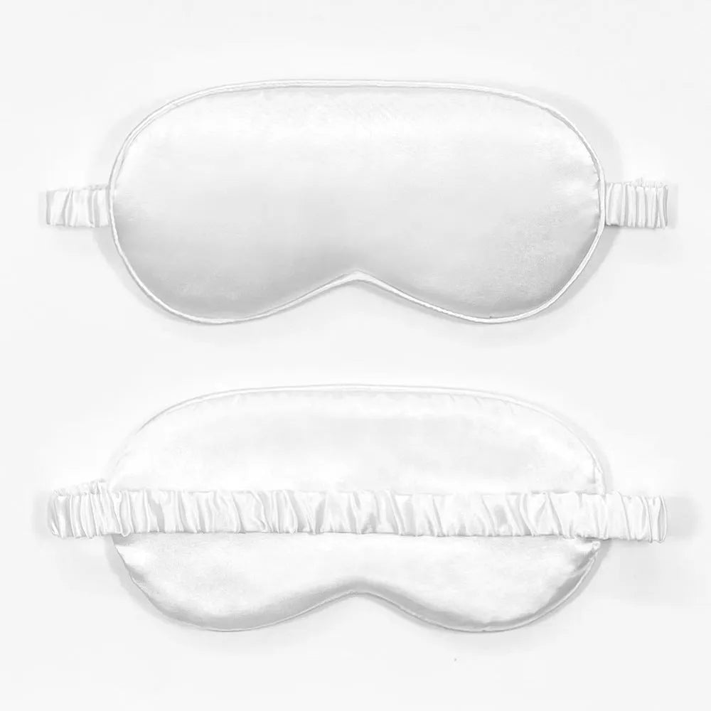 Rayon satin double-sided sleep mask in a selection of solid colours on a white background.
