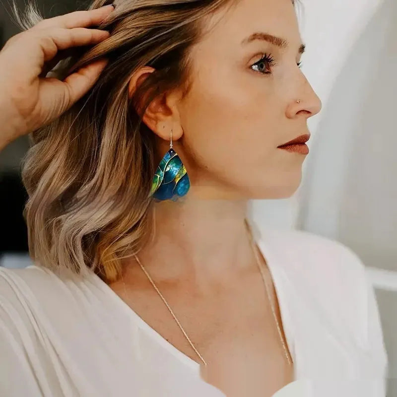 A pair of trendy acrylic drop earrings with a flat branch knot design, shown in style 1 and style 2 variations.