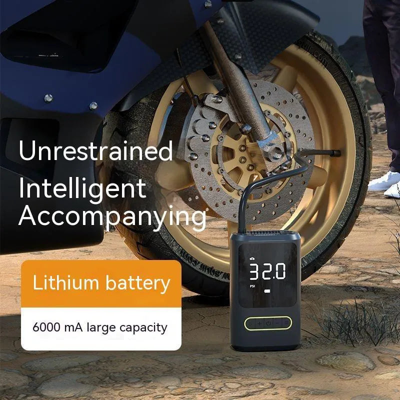 Handheld black digital display wireless car air pump with LED light and nozzle adapters.