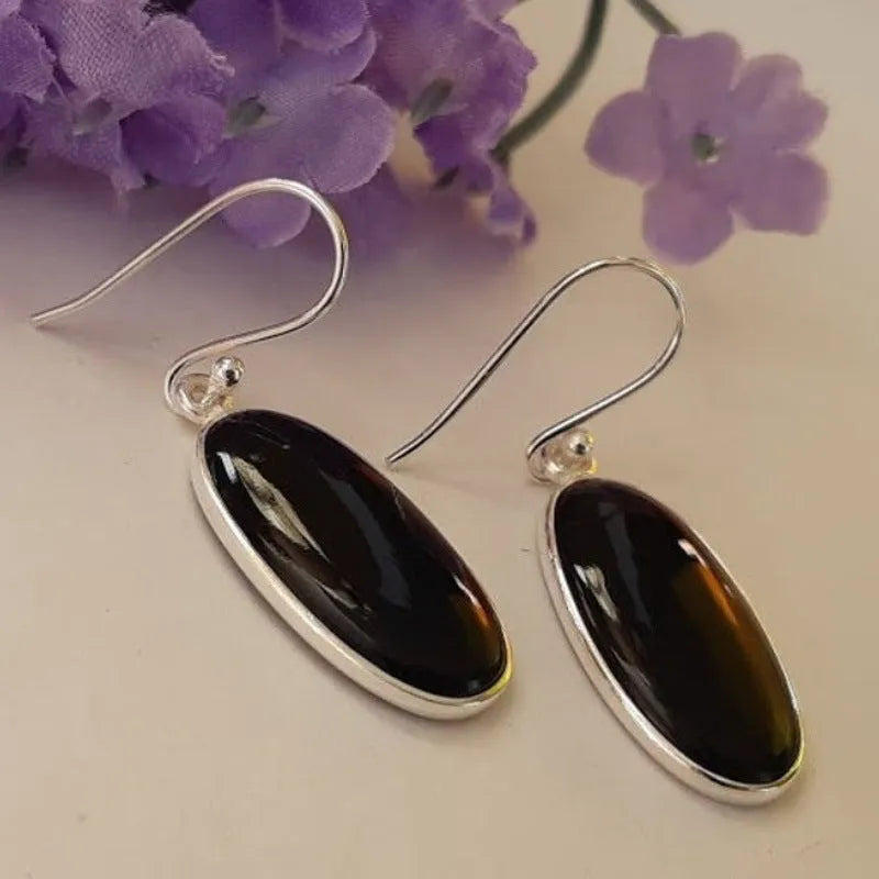 Women's geometric earrings with oval black agate pendant and electroplated silver-coloured finish