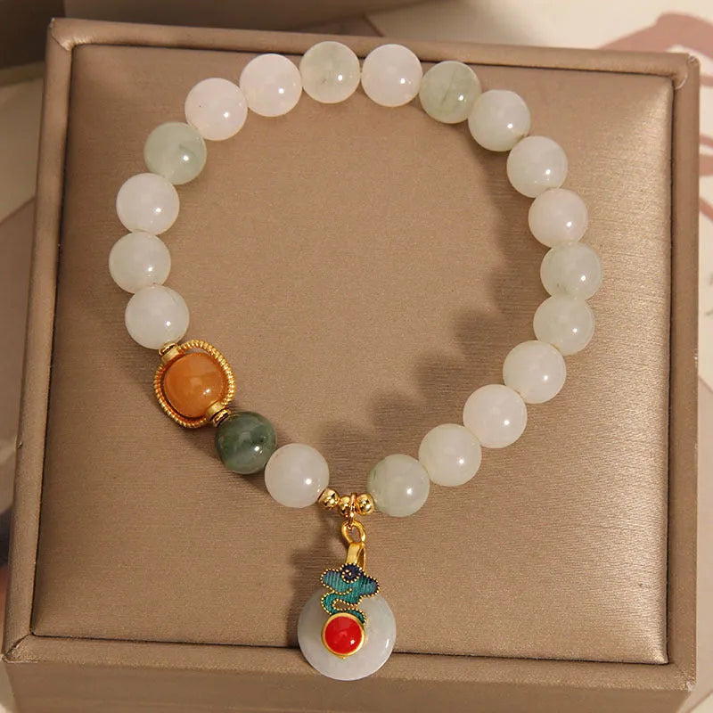 Women's ice jade bracelet with pearl accents and carved jade buckle clasp