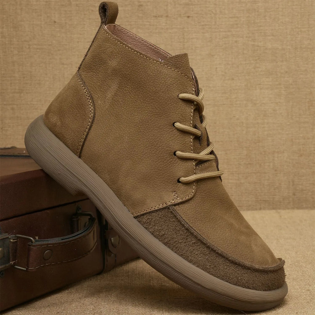 Men's grey genuine leather Martin boots with lace-up front and wedge heel on a textured background.