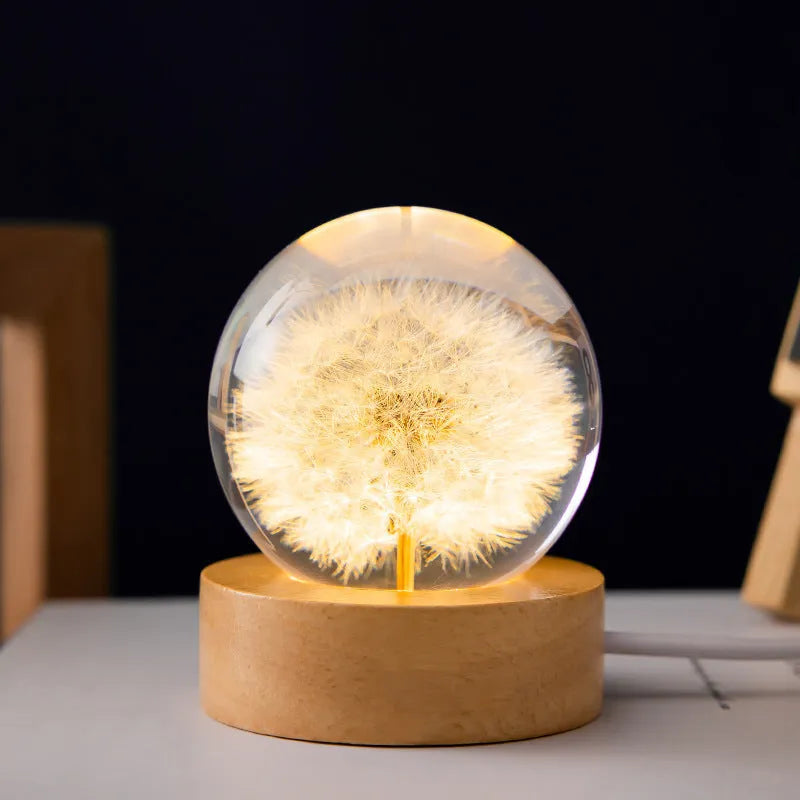 3D dandelion eternal flower inside a luminous resin crystal ball on a beech wood stand base.