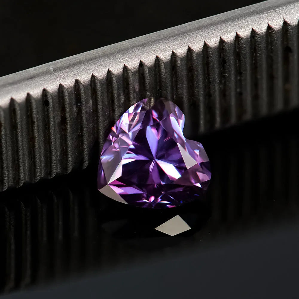 Heart-shaped moissanite gemstone in lemon yellow colour, shown alongside other colour options.