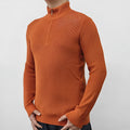 Man wearing a grey half-turtleneck zip-front sweater, a cotton blend pullover for casual wear.