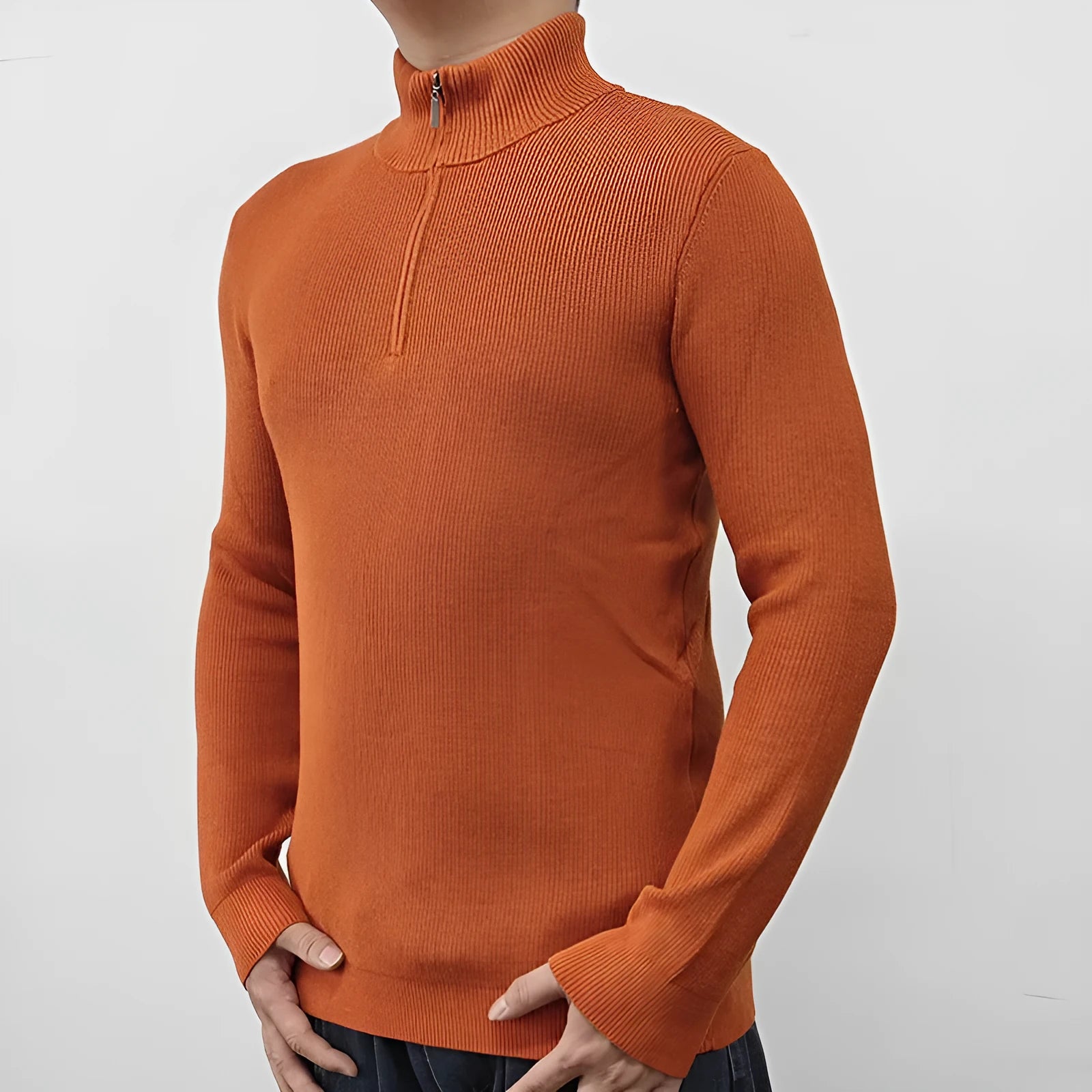 Man wearing a grey half-turtleneck zip-front sweater, a cotton blend pullover for casual wear.