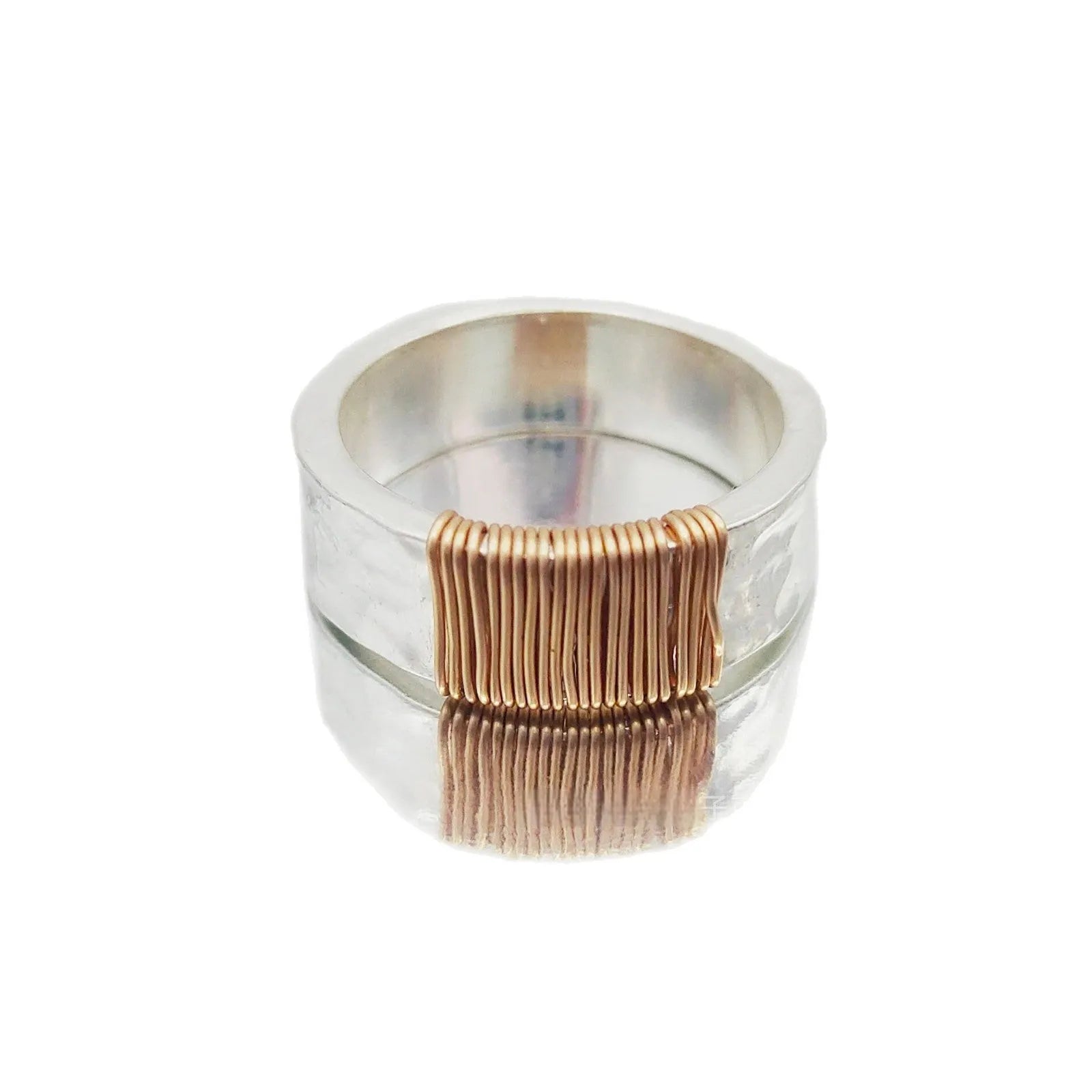 Copper geometric wide ring bracelet with irregular coil design in silver-gold colour.