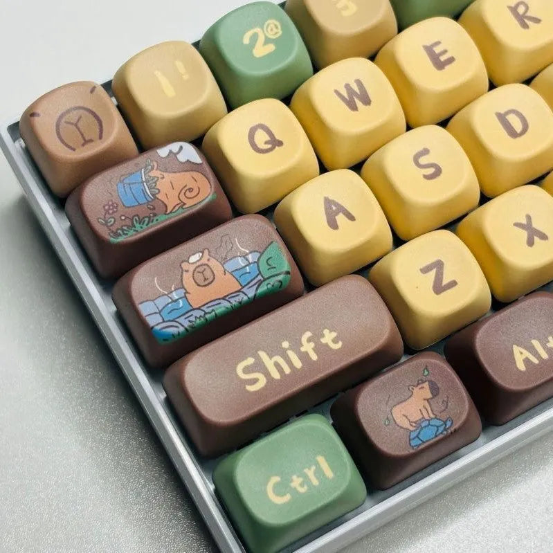 Capabala Girl MOA style 130-piece ABS plastic keycap set for mechanical keyboards, spread out showing alphanumeric and modifier keys.
