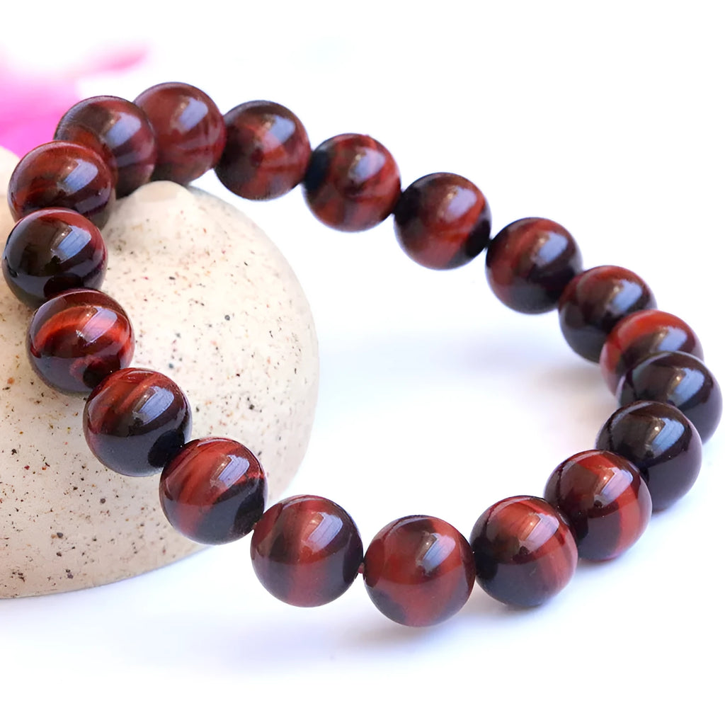 Red tigereye cat's eye beaded bracelet, grade 7A Lightning Eye Reserva, round geometric wood alexandrite beads