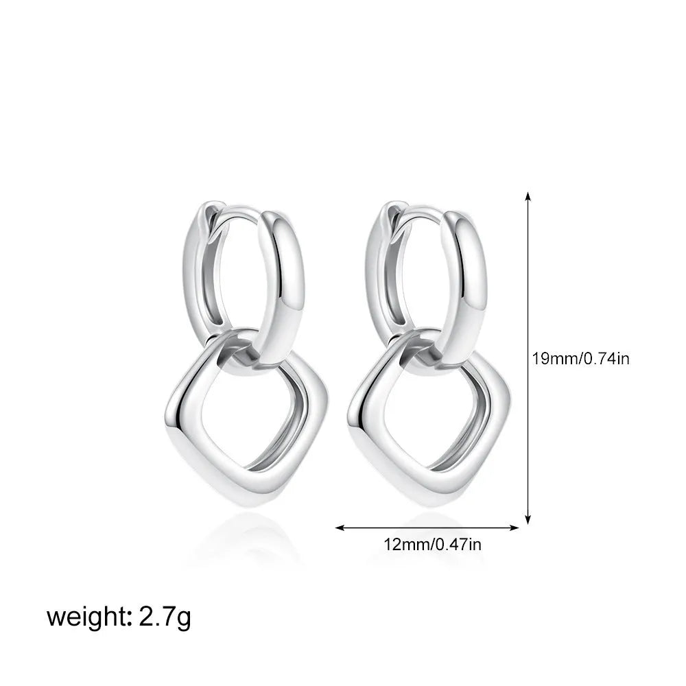 Copper geometric square double ring twist ear clip earrings on display