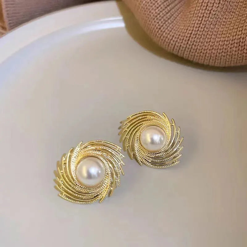 Women's vintage pearl earrings with flower-shaped alloy design and irregular hand-finished elements