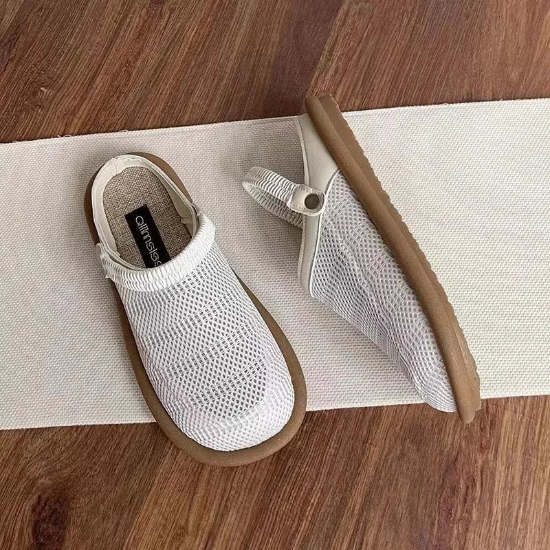 Breathable linen and mesh slip-on shoe with a soft rubber sole in milky white colour.