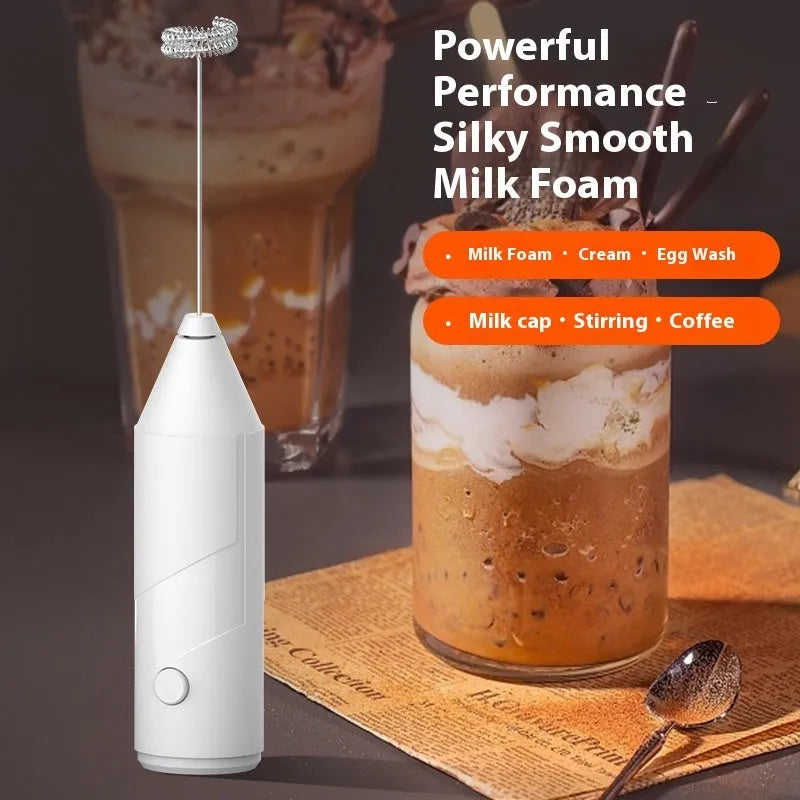 Mini handheld electric milk frother in black, white, or khaki colour with a stainless steel whisk and USB port.