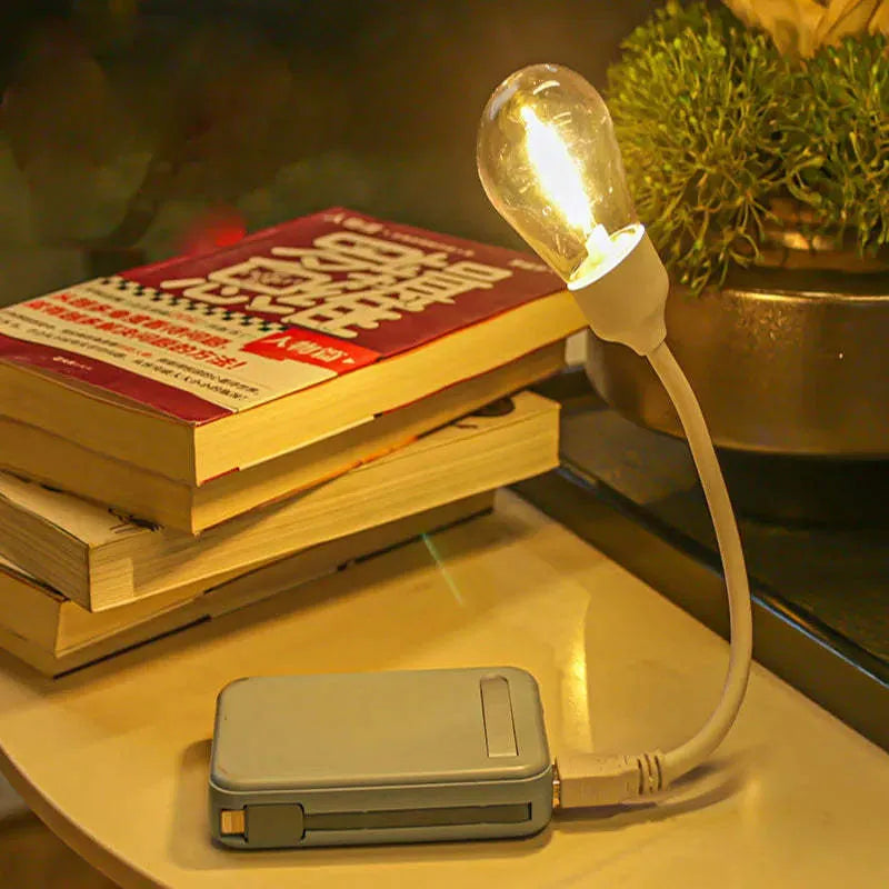 USB rechargeable folding tungsten night light showing warm white illumination