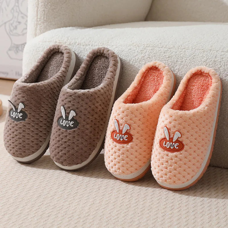 Women's rabbit plaid artificial fur house slippers with a flat heel and rubber sole, shown in apricot colour.