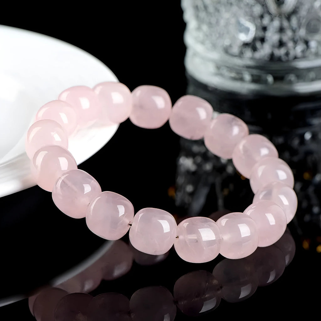 Pink natural bamboo crystal barrel bead bracelet with 11x12mm beads and geometric design.