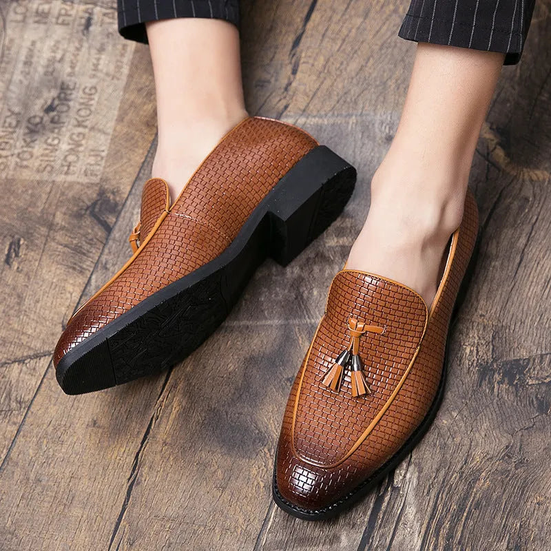 Men's black pointed toe slip on shoes with a tassel detail, made from artificial PU material for business wear.