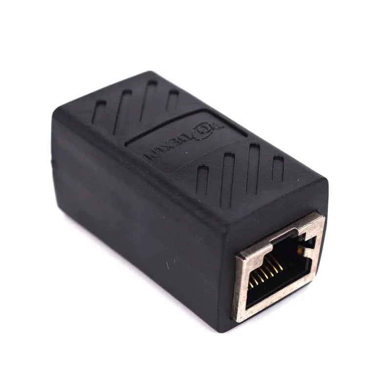 Black RJ45 female to female network cable extender adapter isolated on white