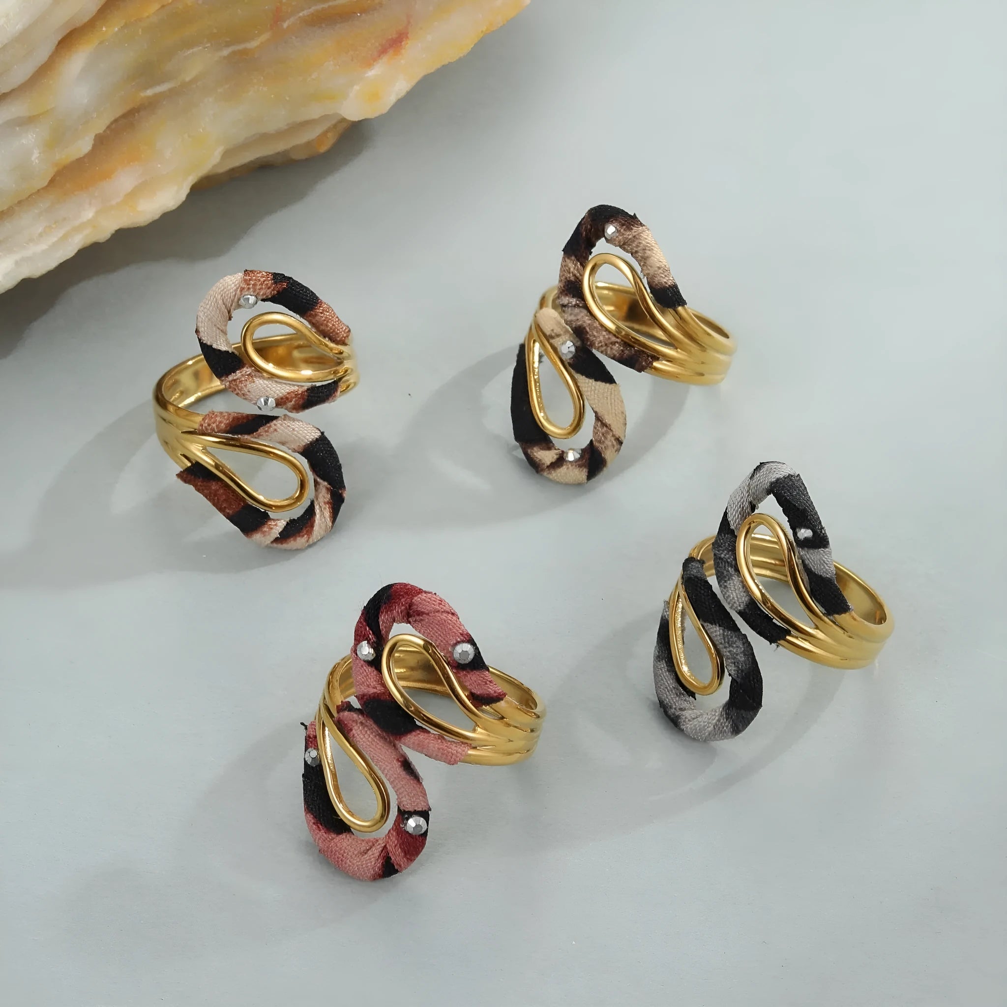 Geometric open mouth ring with leopard print design in electroplated stainless steel showing adjustable free-size construction