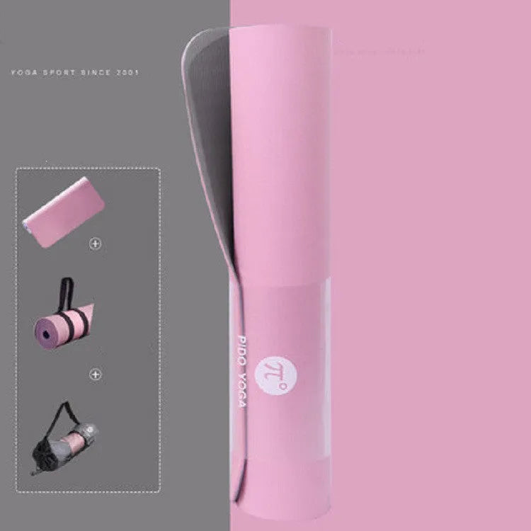 Paido TPE yoga mat in Pink Grey colour rolled out on a wooden floor with a yoga block nearby