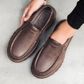 Men's black waterproof slip-on work shoes with platform sole and leather lining