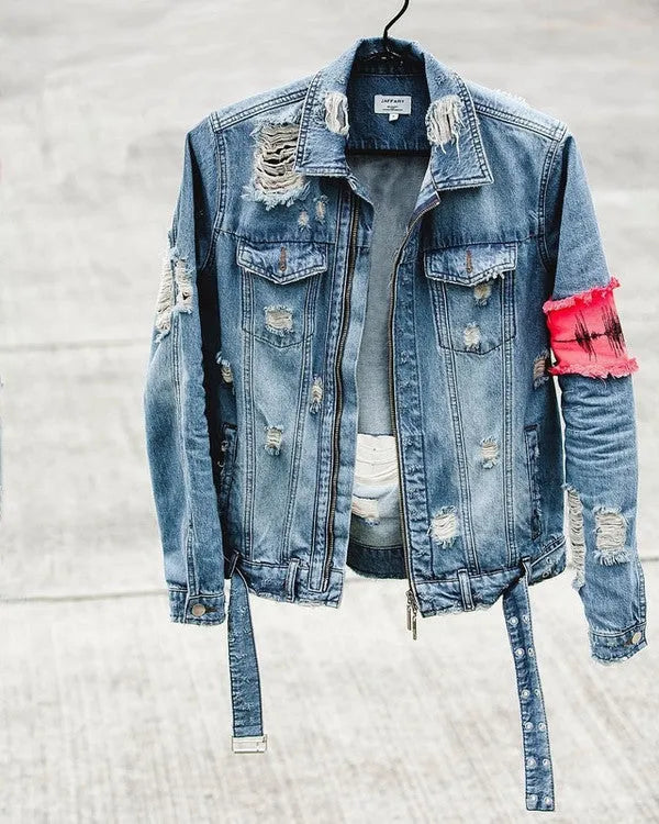Blue embroidered cotton denim jacket for women on model, showing decorative stitching on front panels